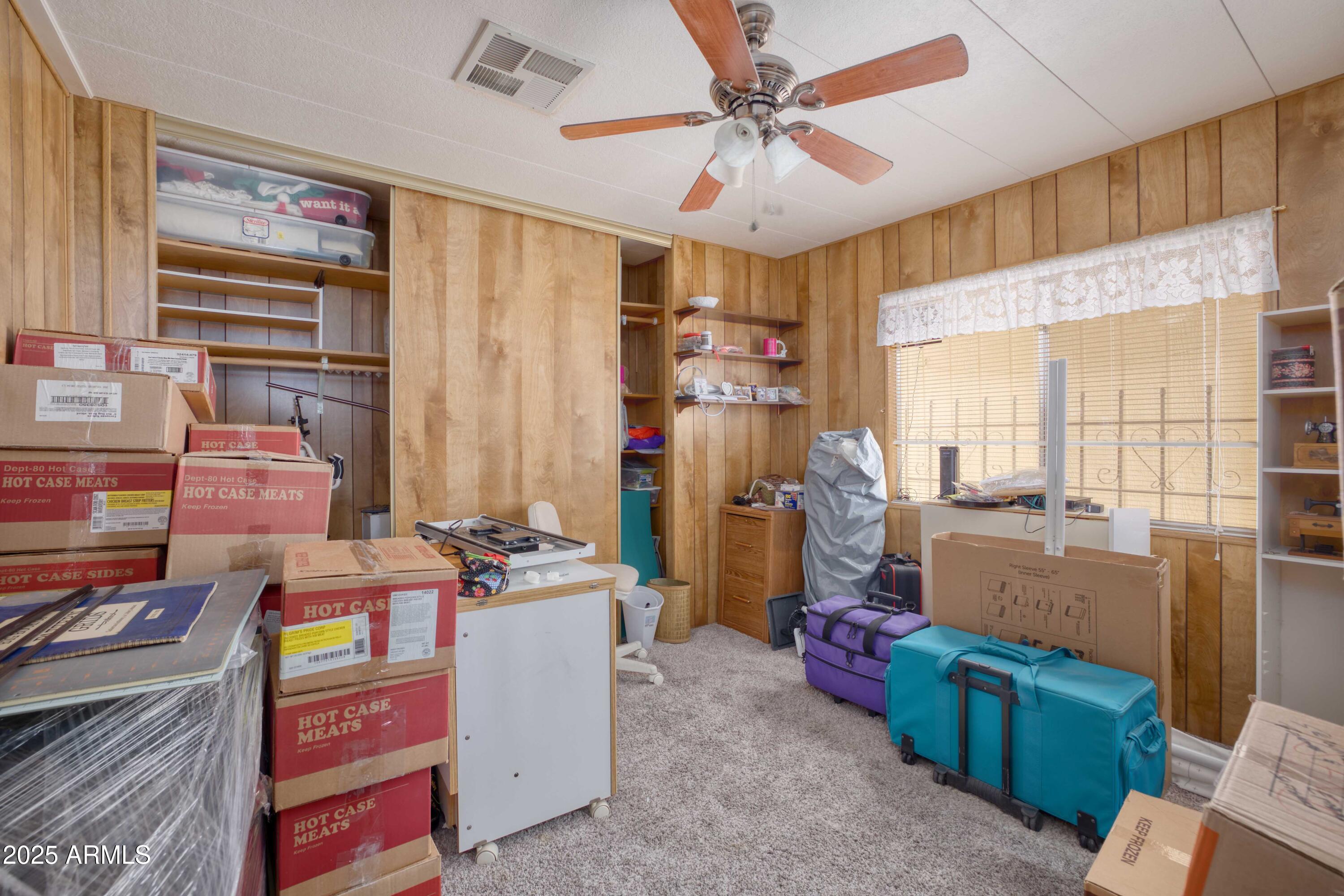 9302 East Broadway Road, Unit 185 Mesa, AZ 85208 - Photo 21 of 24 a room with furniture and a window