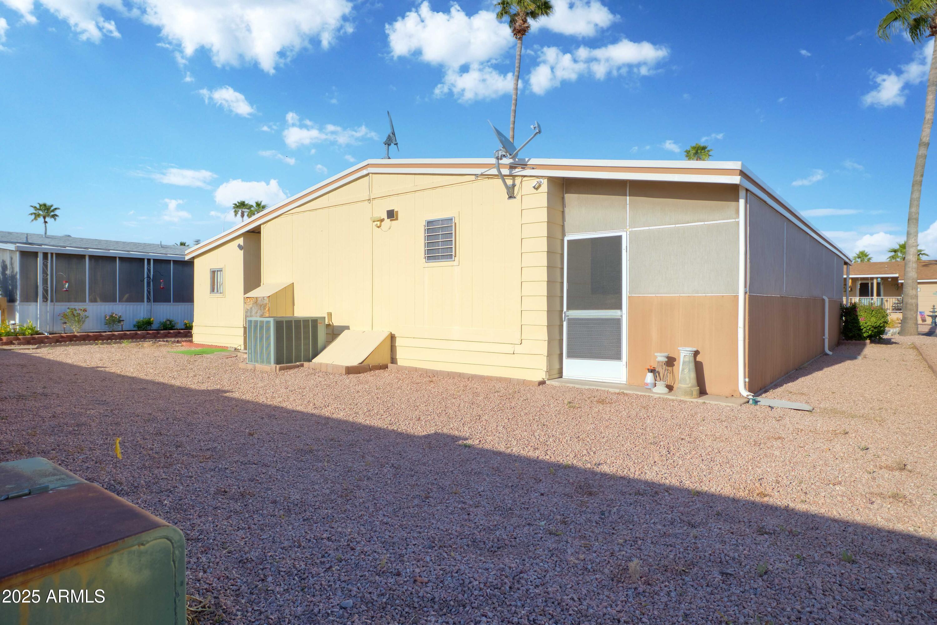 9302 East Broadway Road, Unit 185 Mesa, AZ 85208 - Photo 24 of 24 a view of a house with a snow in the yard