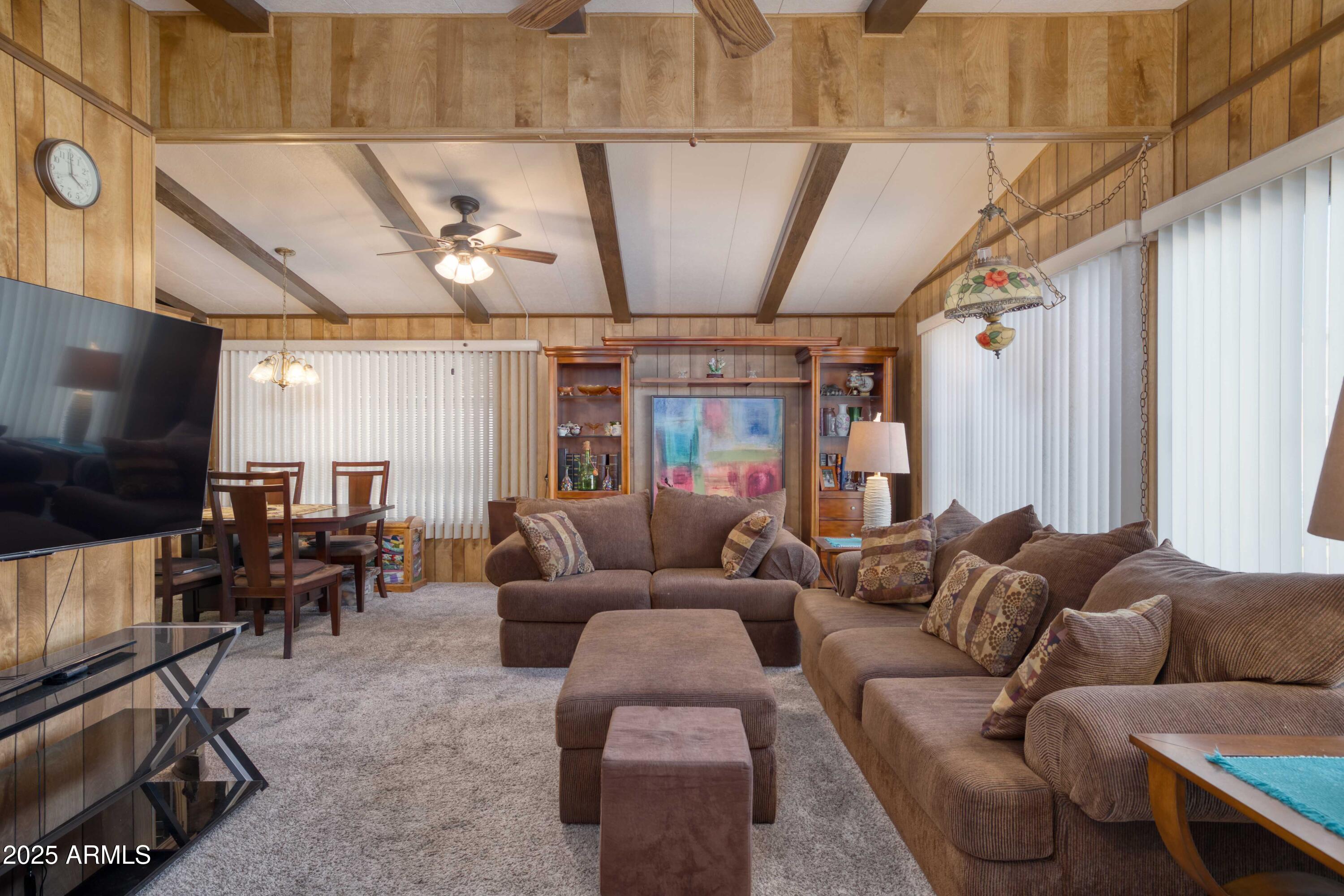 9302 East Broadway Road, Unit 185 Mesa, AZ 85208 - Photo 9 of 24 a living room with furniture and a flat screen tv