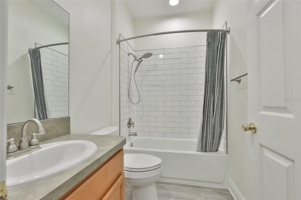 708 Coade Stone Drive Seffner, FL 33584 - Photo 20 of 48 a bathroom with a sink toilet and shower