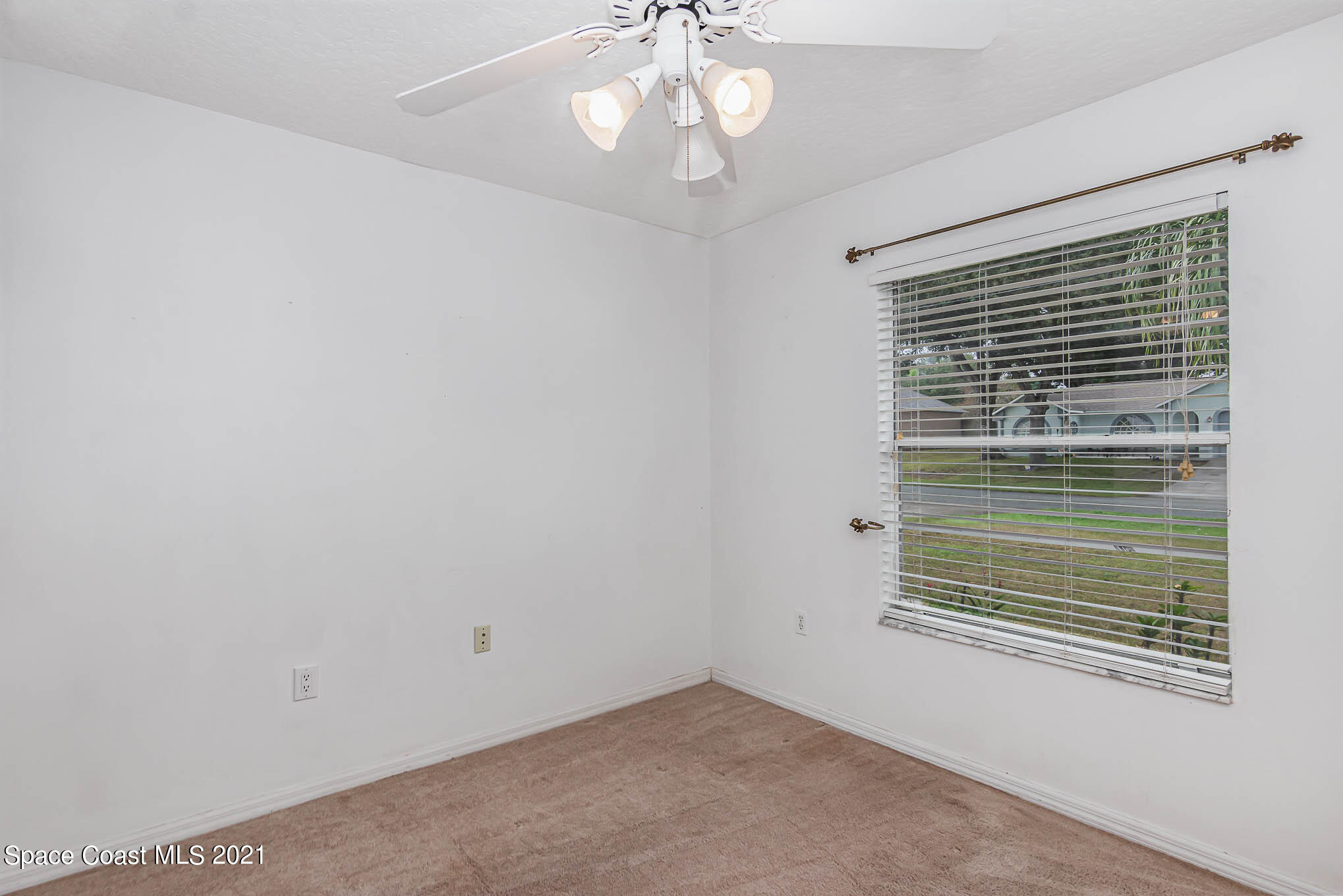 6755 Cairo Road Cocoa, FL 32927 - Photo 15 of 22 a view of an empty room with a window