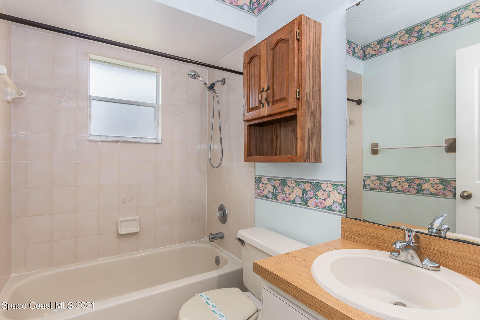 6755 Cairo Road Cocoa, FL 32927 - Photo 16 of 22 a bathroom with a sink toilet and shower