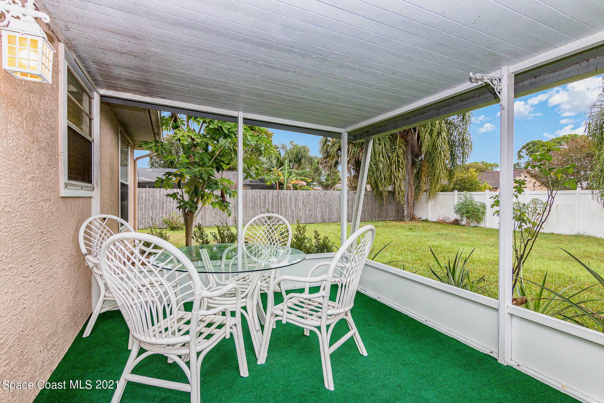 6755 Cairo Road Cocoa, FL 32927 - Photo 18 of 22 a view of an chairs and table in the balcony