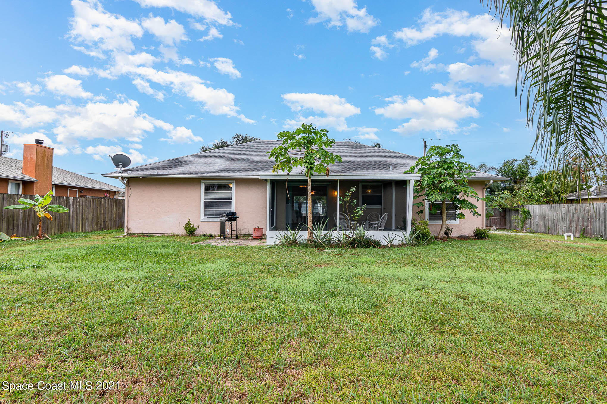 6755 Cairo Road Cocoa, FL 32927 - Photo 20 of 22 a front view of a house with a garden