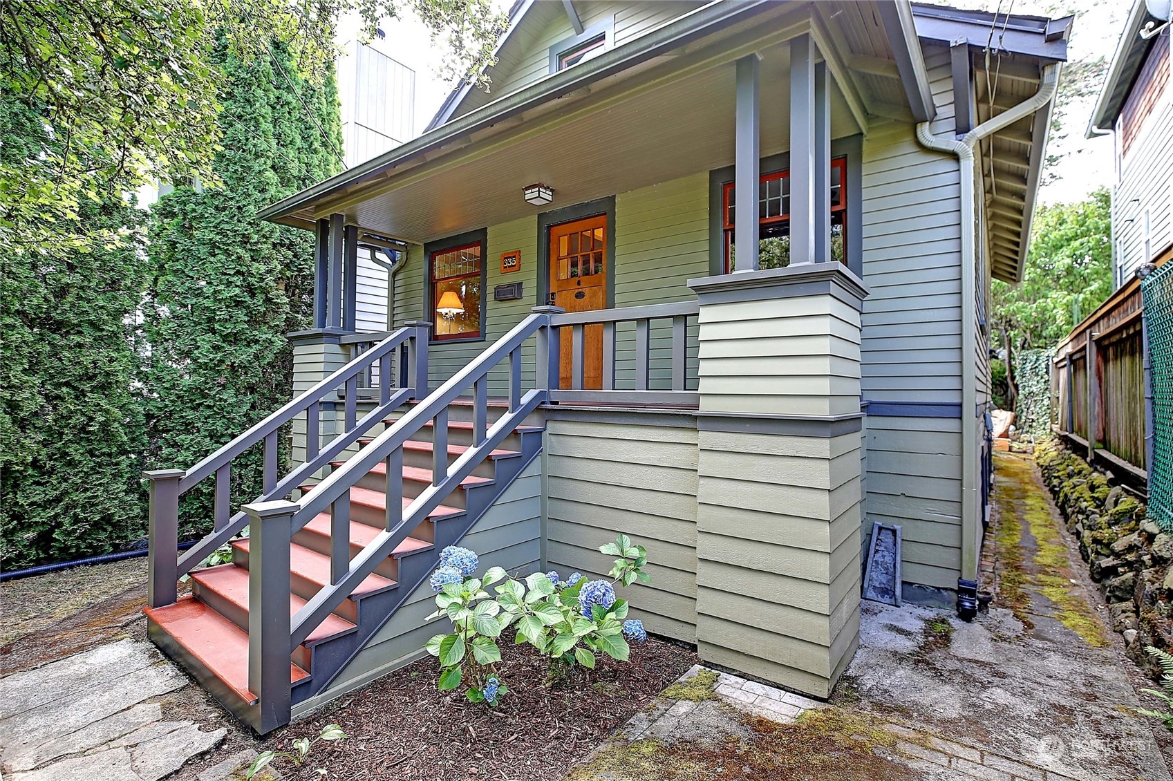 335 North 77th Street Seattle, WA 98103 - Photo 3 of 36 a view of a house with backyard and wooden deck