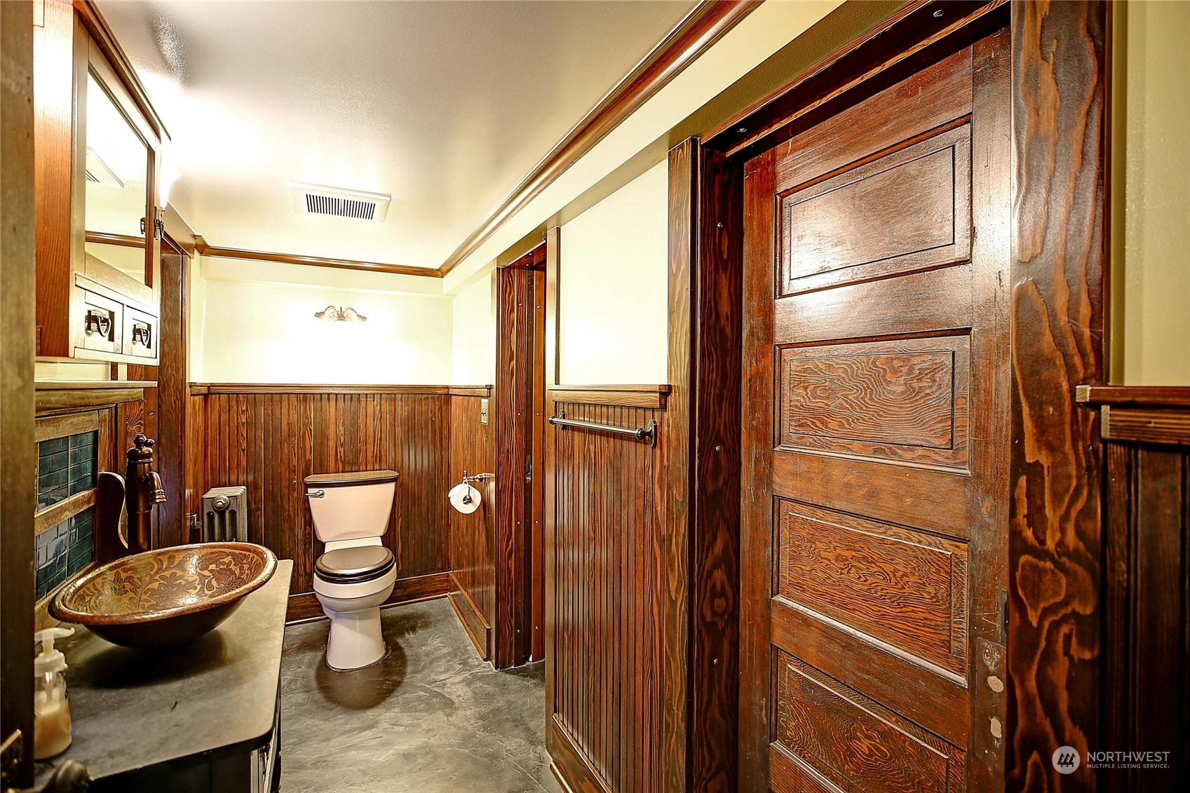 335 North 77th Street Seattle, WA 98103 - Photo 34 of 36 a bathroom with a toilet a sink and a window