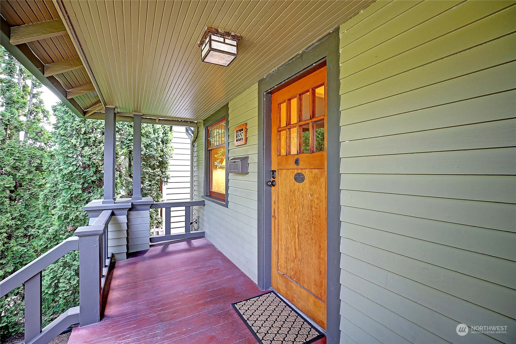 335 North 77th Street Seattle, WA 98103 - Photo 5 of 36 a view of a porch with wooden floor and outdoor space