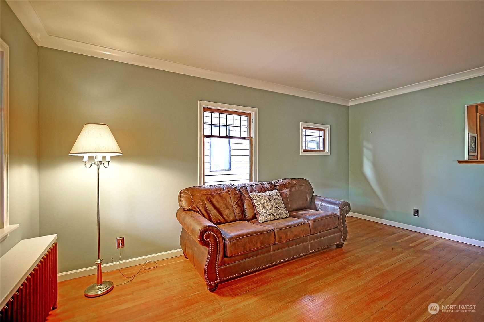 335 North 77th Street Seattle, WA 98103 - Photo 8 of 36 a living room with furniture and a window