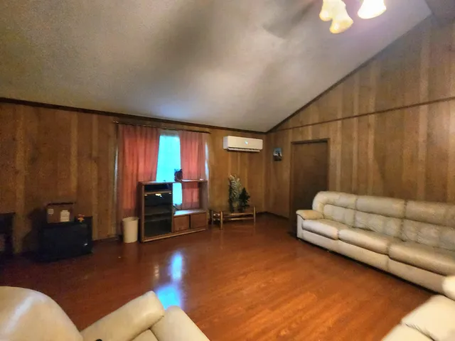 a living room with furniture and a gate