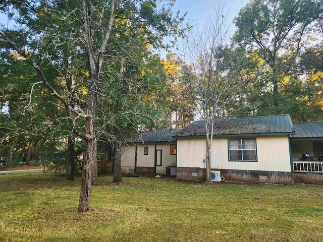 a backyard of a house with lots of green space