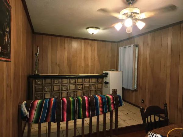 a view of hallway with furniture