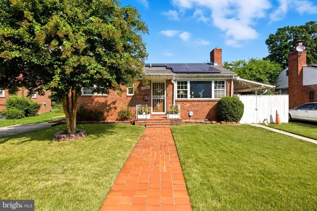 a front view of a house with yard
