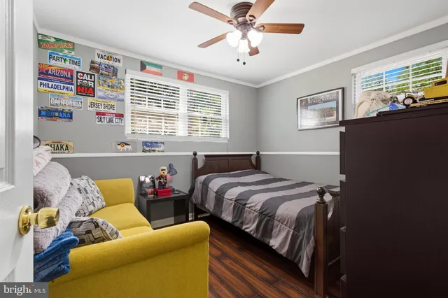 a bedroom with a bed and a couch