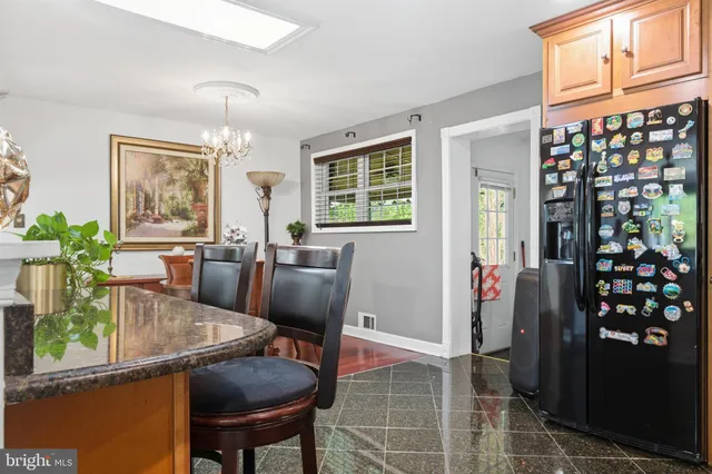 a view of a dining room with furniture window and flowerpot