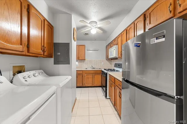 a kitchen with a refrigerator and a sink