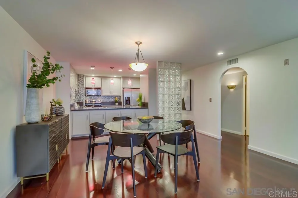 2500 Torrey Pines Road, Unit 402 La Jolla, CA 92037 - Photo 20 of 21 a view of a dining room with furniture and wooden floor