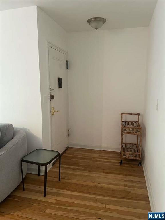 1480 Terrace, Unit 4 Teaneck, NJ 07666 - Photo 4 of 14 a view of a room with wooden floor and furniture