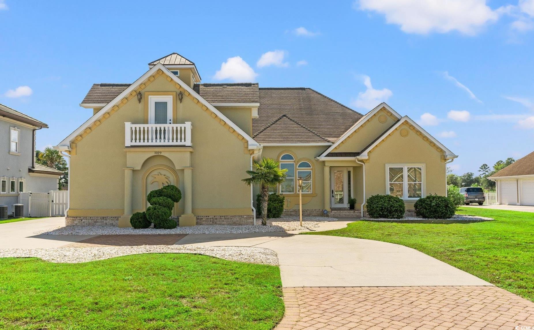 Beautiful home on large lot with rounded driveway with pavers