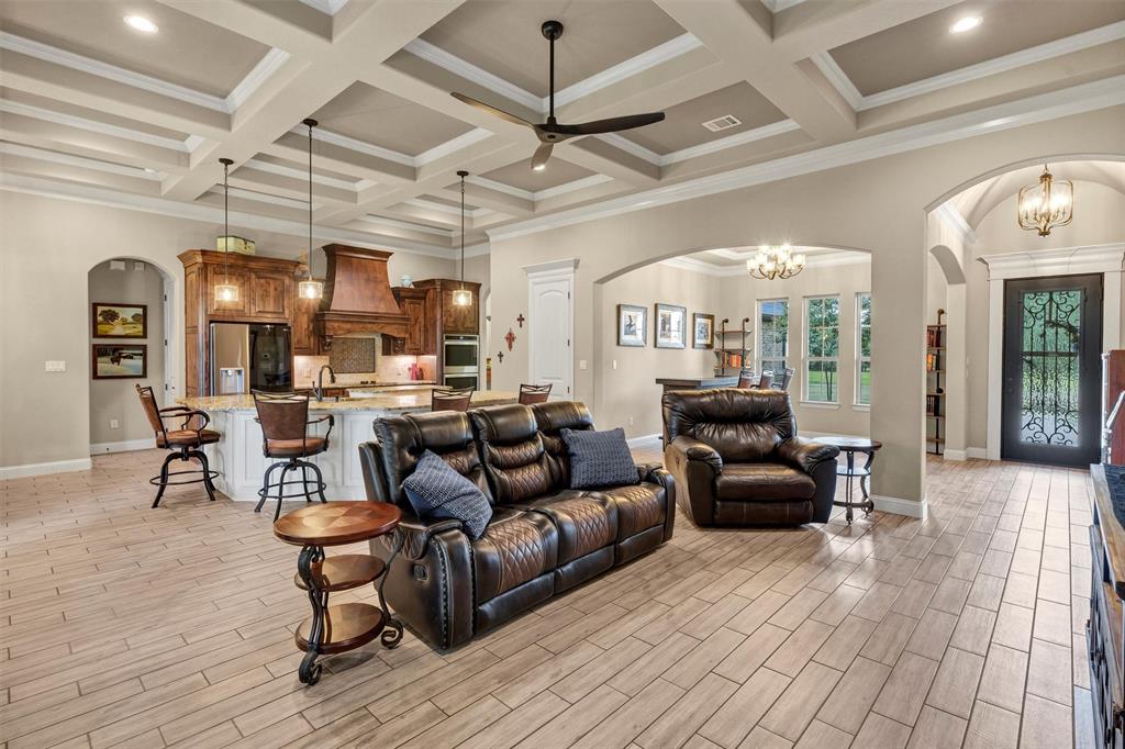 4030 Neri Oaks Court Granbury, TX 76048 - Photo 11 of 40 a living room with furniture and wooden floors