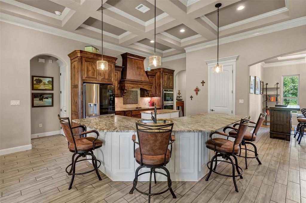4030 Neri Oaks Court Granbury, TX 76048 - Photo 12 of 40 a view of a dining room with furniture window and wooden floor