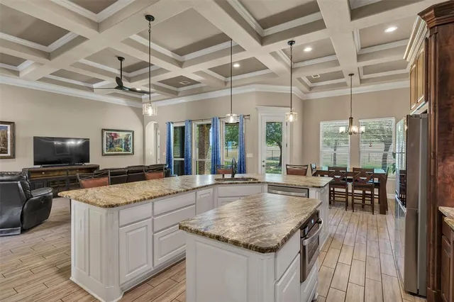 a kitchen with center island and center island