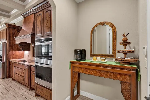 a kitchen with stainless steel appliances granite countertop a stove and a sink