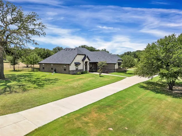 a house with garden in front of it