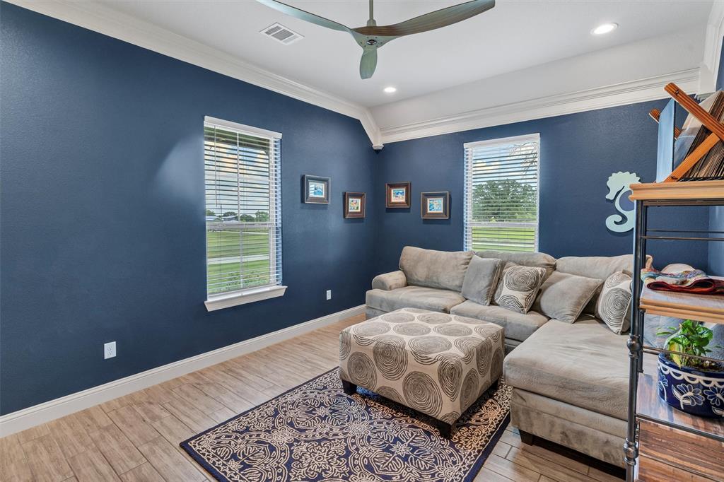 4030 Neri Oaks Court Granbury, TX 76048 - Photo 26 of 40 a living room with furniture and a window