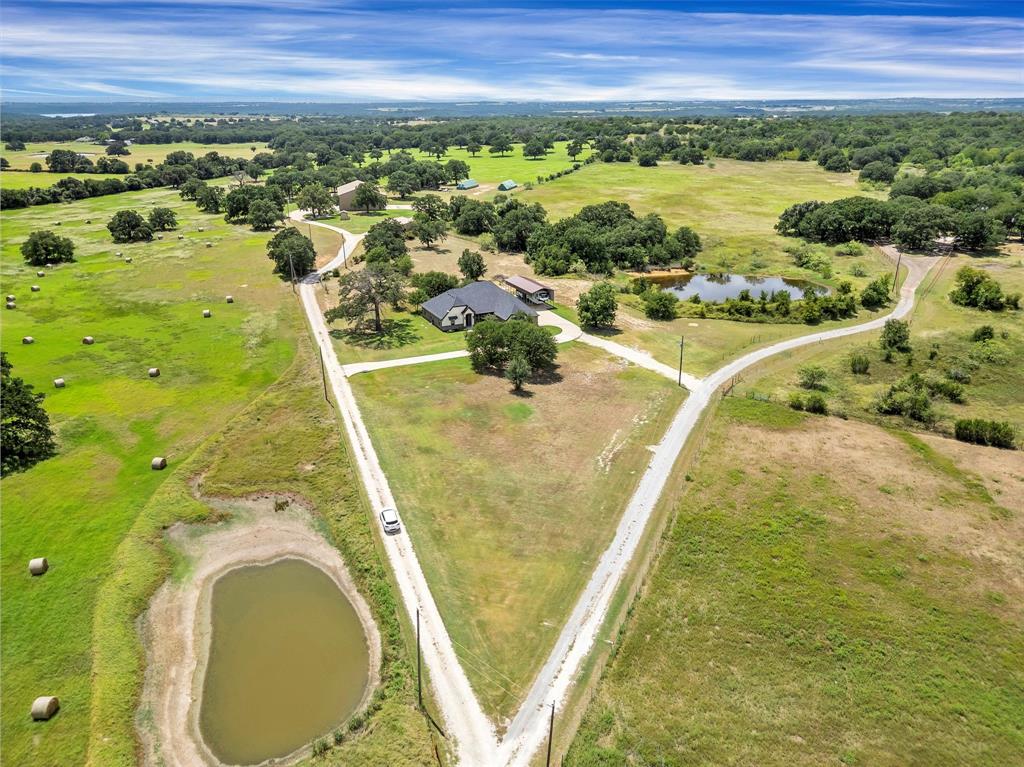 4030 Neri Oaks Court Granbury, TX 76048 - Photo 38 of 40 a view of a swimming pool and outdoor space