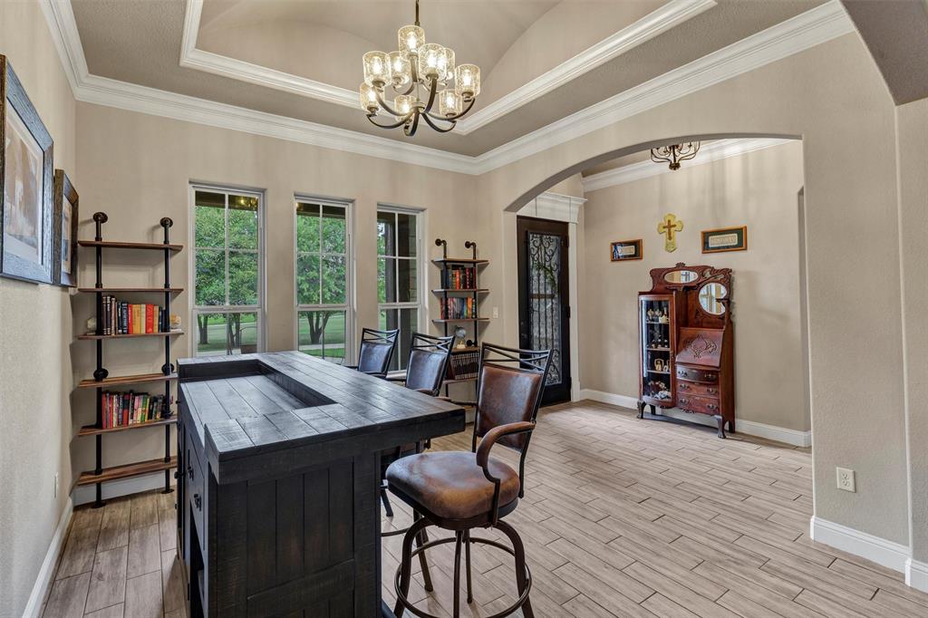 4030 Neri Oaks Court Granbury, TX 76048 - Photo 9 of 40 a view of a room with furniture and a chandelier