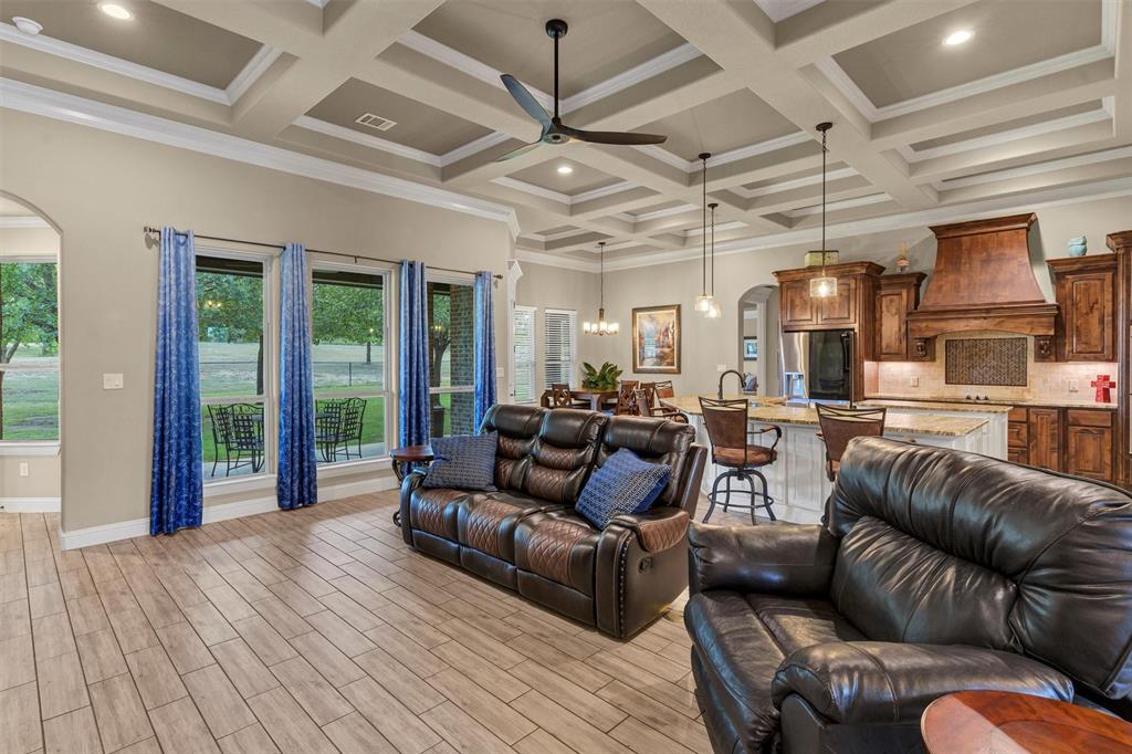 4030 Neri Oaks Court Granbury, TX 76048 - Photo 10 of 40 a living room with furniture ceiling fan and a large window