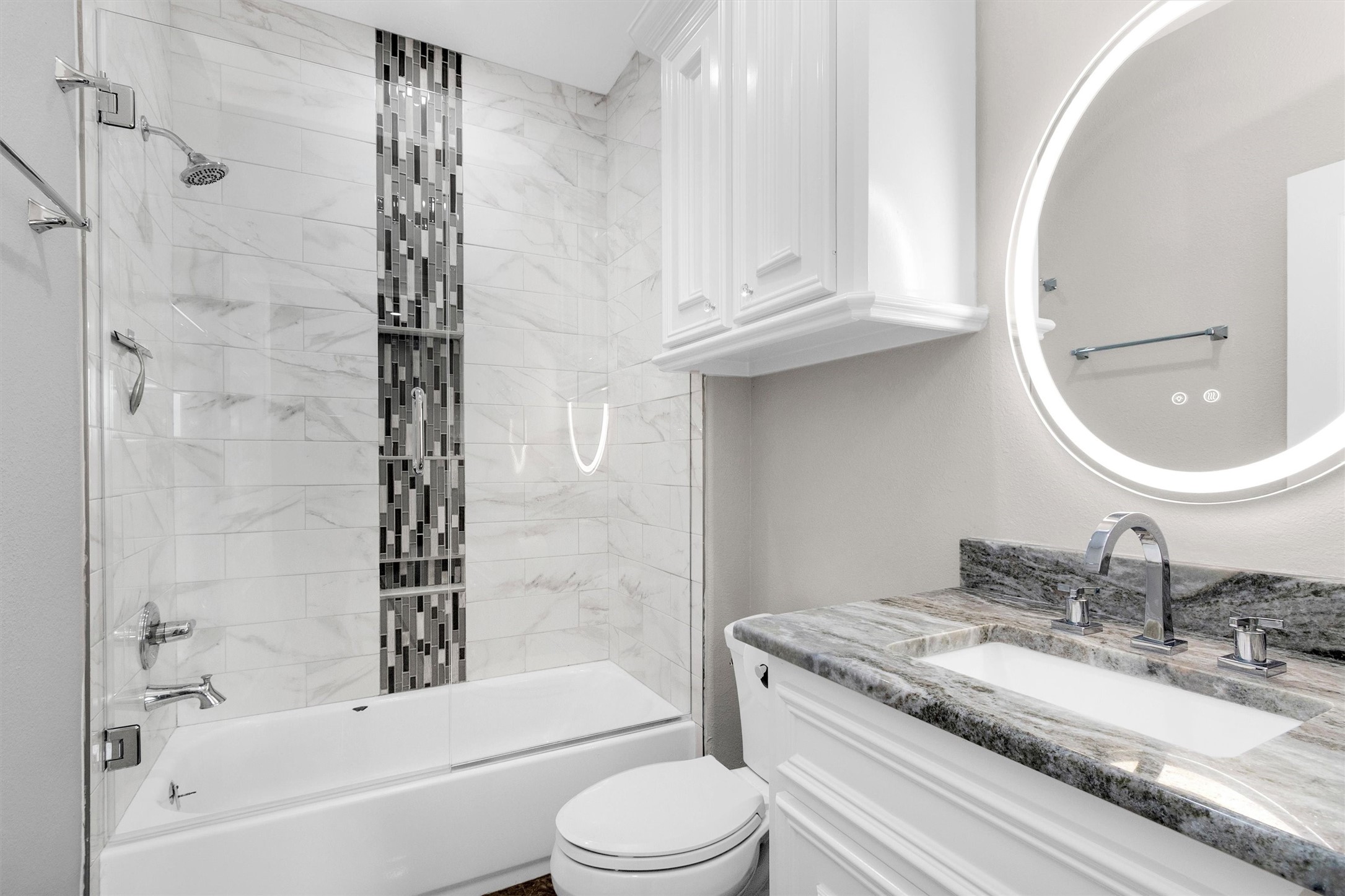 10887 Decatur Street Willis, TX 77318 - Photo 38 of 50 Well-appointed en-suite bath with custom tile work, glass enclosure, and updated vanity—clean, sharp, and move-in ready.