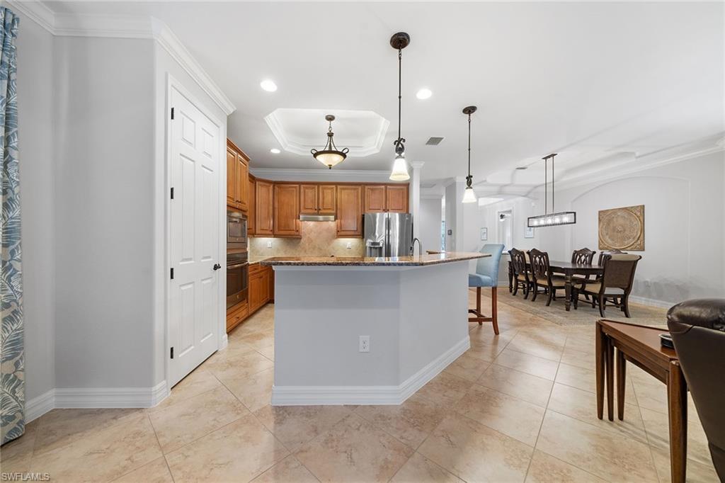 12614 Fenhurst Way Naples, FL 34120 - Photo 12 of 50 a view of kitchen with furniture and living room
