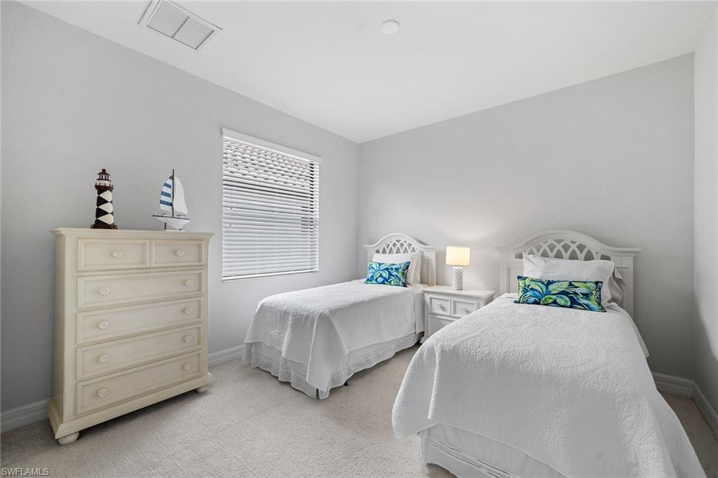 12614 Fenhurst Way Naples, FL 34120 - Photo 27 of 50 a bedroom with two beds and two dressers