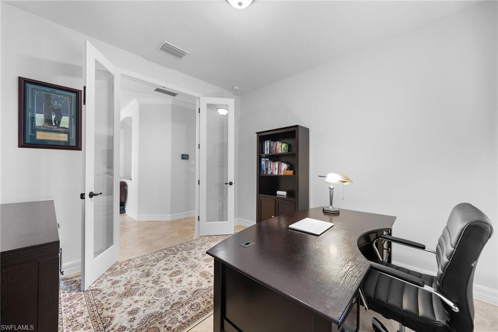 12614 Fenhurst Way Naples, FL 34120 - Photo 30 of 50 a view of a workspace with furniture