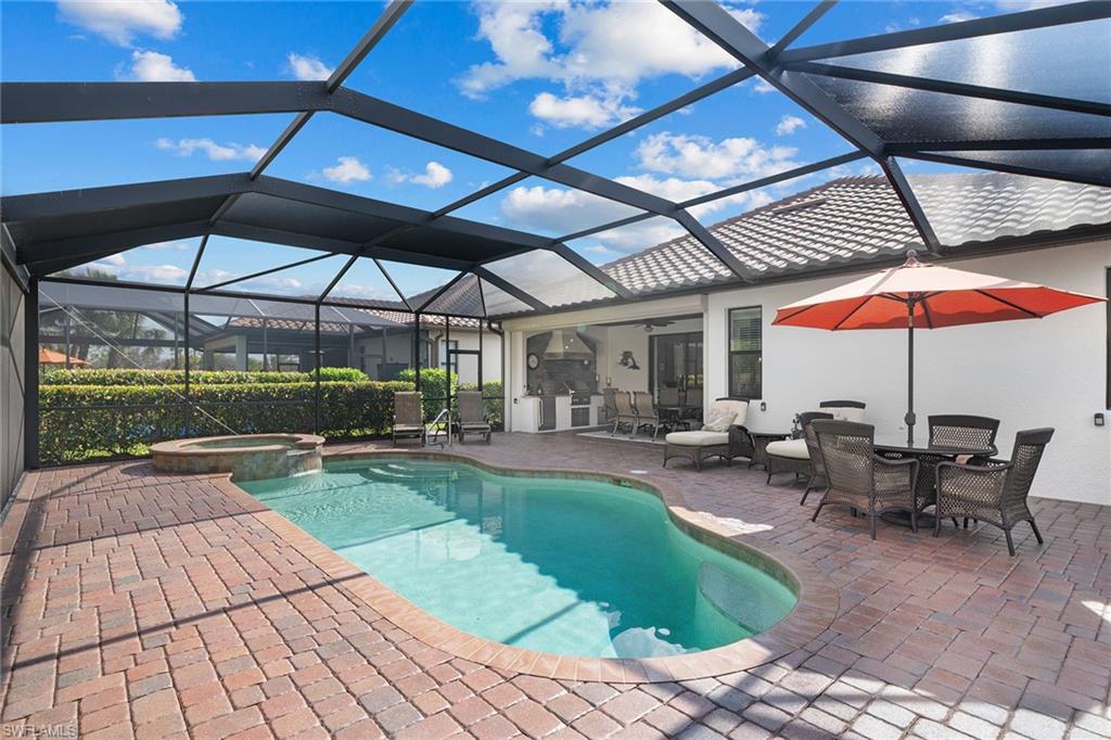 12614 Fenhurst Way Naples, FL 34120 - Photo 41 of 50 a view of a swimming pool with a patio
