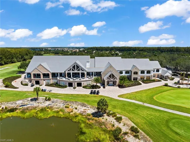 a aerial view of a house with swimming pool garden and patio