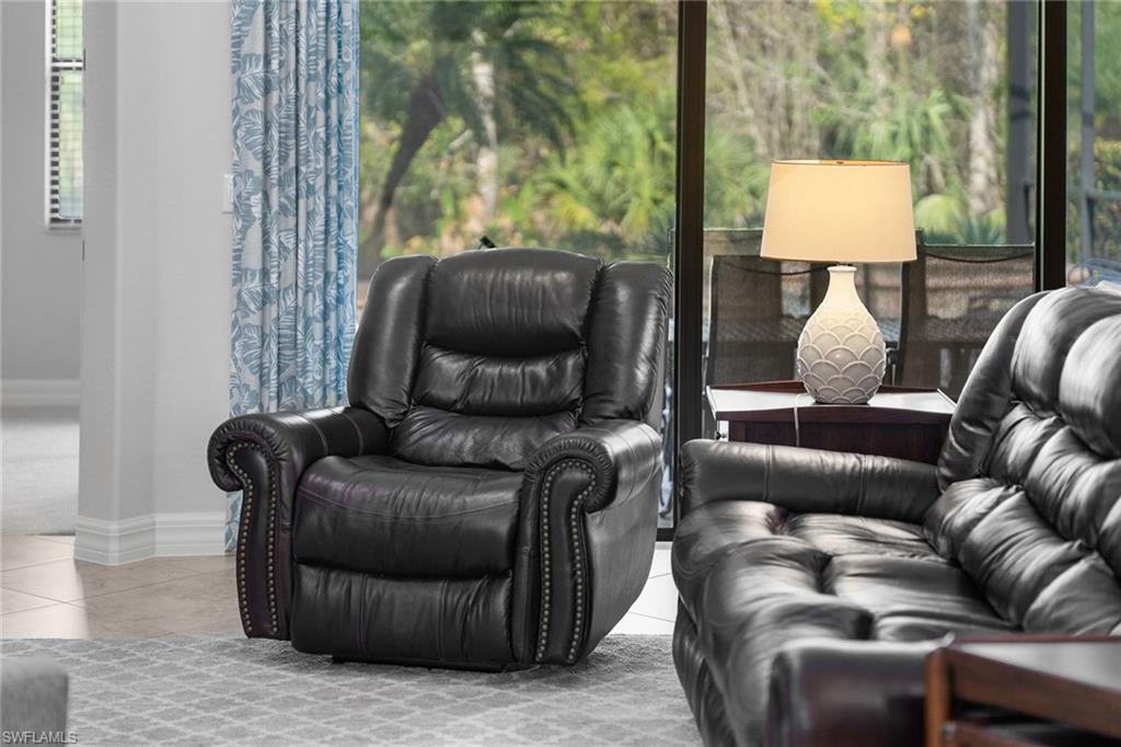 12614 Fenhurst Way Naples, FL 34120 - Photo 9 of 50 a living room with furniture and a window