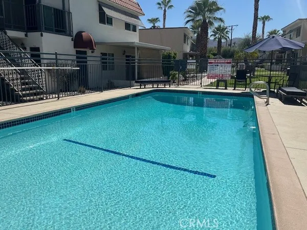 a view of a swimming pool with a patio