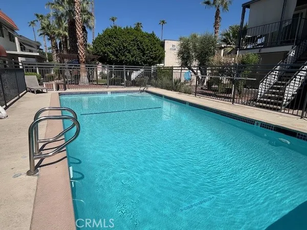 a view of a swimming pool with a patio