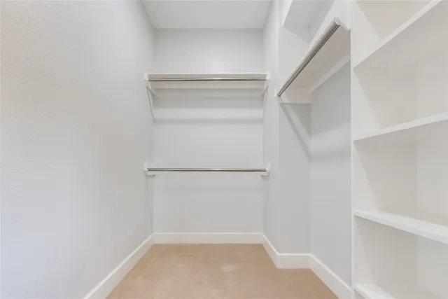 a view of an empty walk in closet