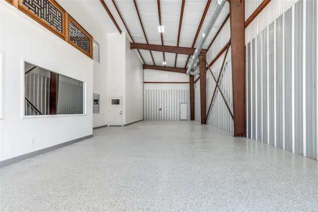 a view of an empty room with a fireplace