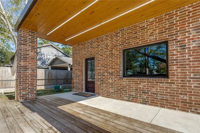 a view of a brick house with a wooden floor