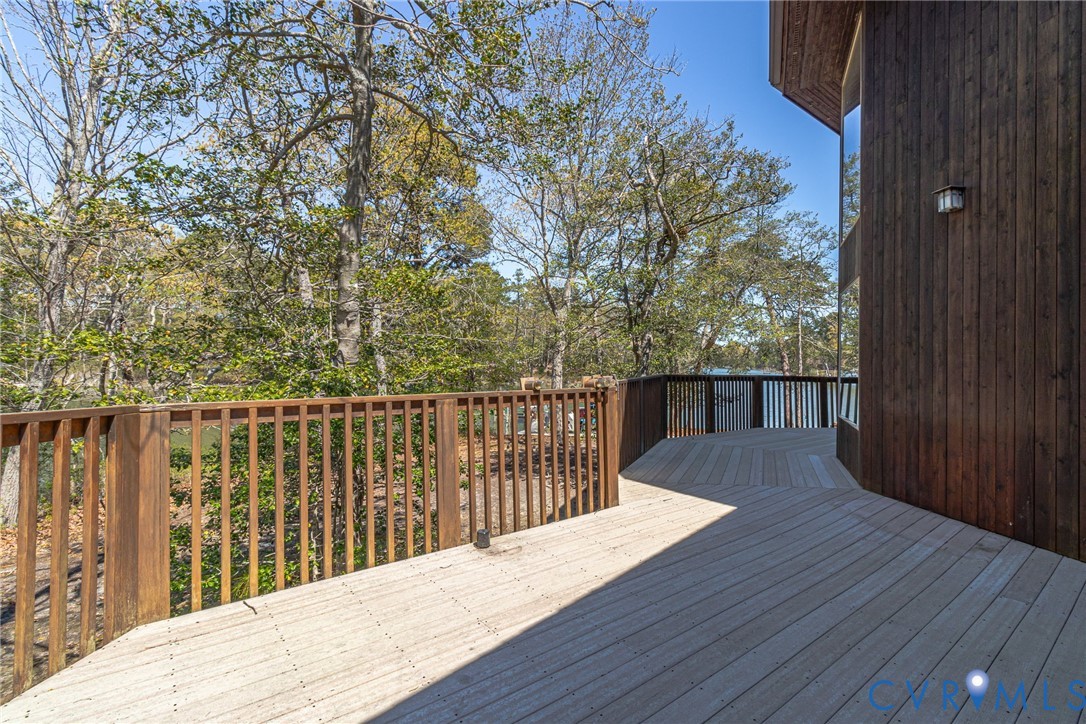 176 Baypointe Court Reedville, VA 22539 - Photo 14 of 60 a balcony with wooden floor and fence