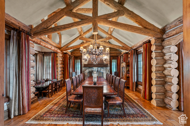 1943 North Wolf Creek Ranch Road, Unit 12 Heber City, UT 84036 - Photo 17 of 175 Dining room featuring rustic walls, a chandelier, and hardwood / wood-style floors