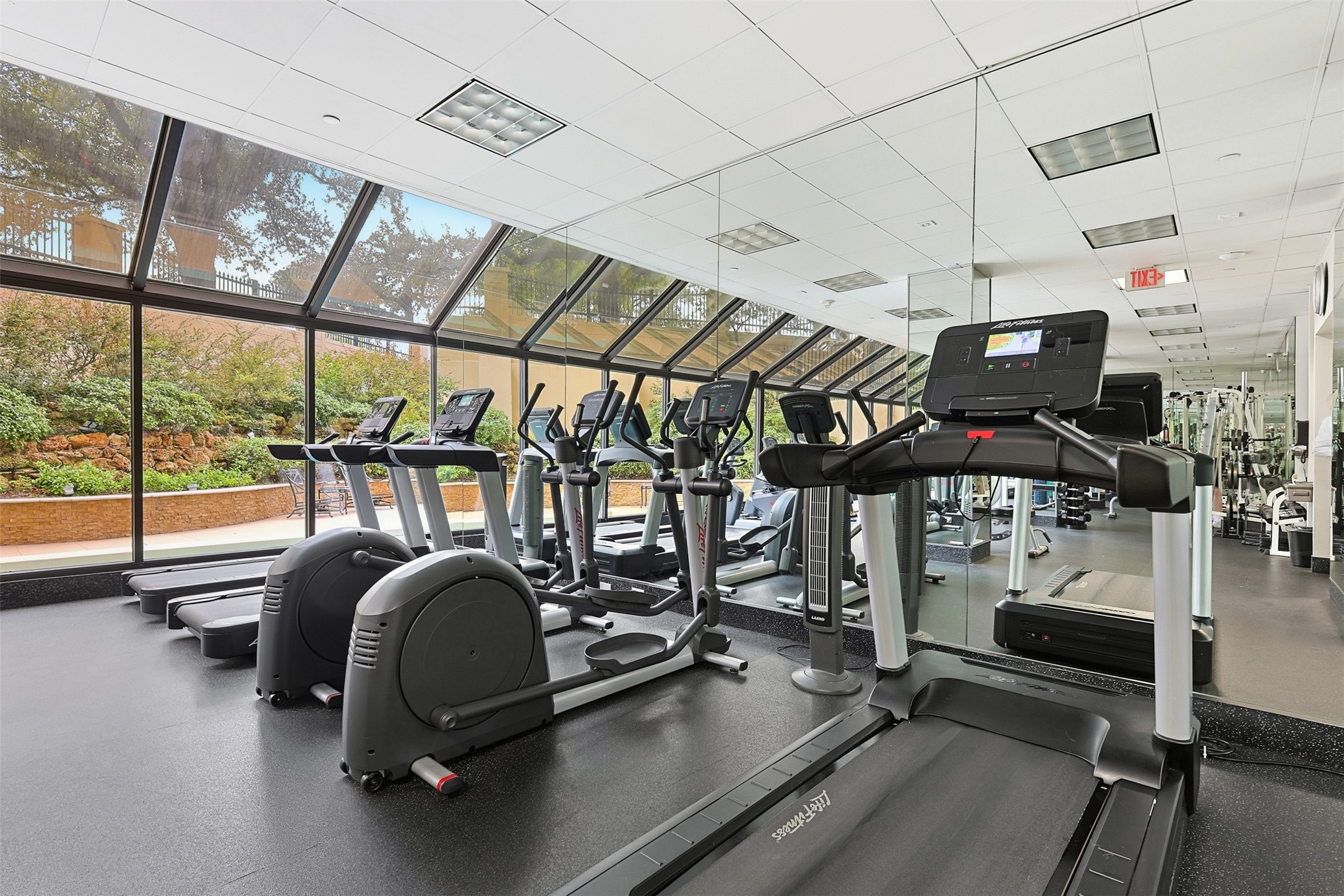 2001 Holcombe Boulevard, Unit 1106 Houston, TX 77030 - Photo 32 of 50 Staying physically active has never been easier when you don't need to leave your building. The fitness center features pretty views of The Spires pool.