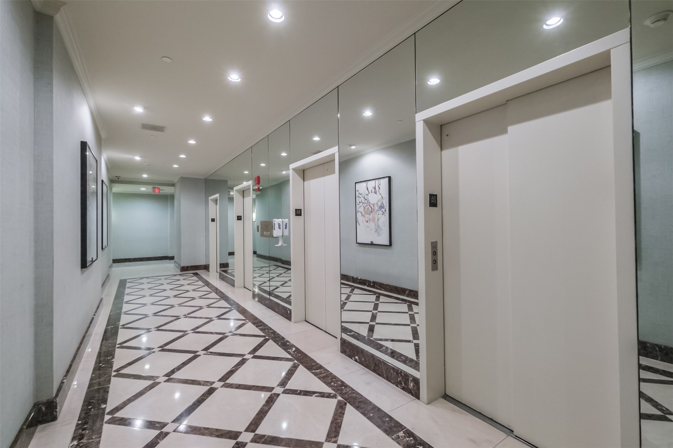 2001 Holcombe Boulevard, Unit 1106 Houston, TX 77030 - Photo 41 of 50 The common areas are maintained by The Spires Maintenance and Housekeeping Departments. This is a view of the hallway leading up to the elevators residents and guests utilize to access the individually owned homes.