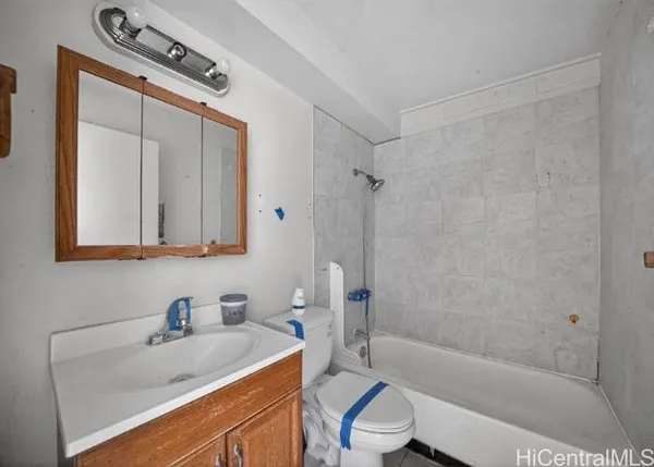 a bathroom with a sink a toilet and a bathtub