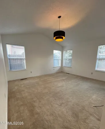 a spacious bathroom with a double vanity sink a large mirror and shower