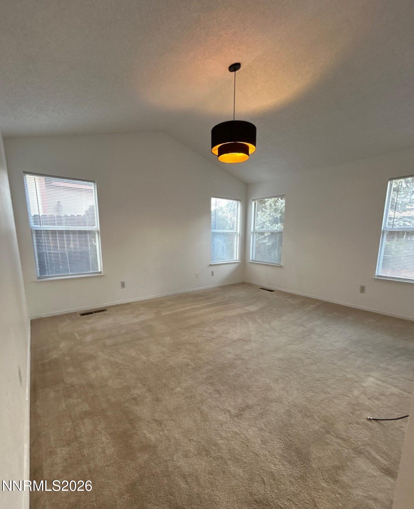 4771 Amber Hill Lane Reno, NV 89523 - Photo 12 of 20 a view of an empty room with windows